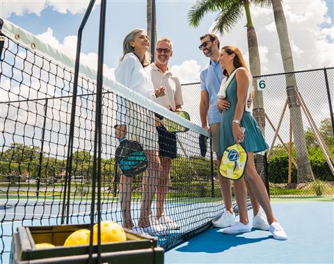 Group of people on tennis court
