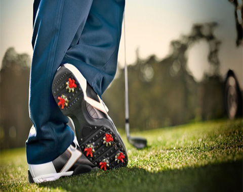 Someone walking on a golf field