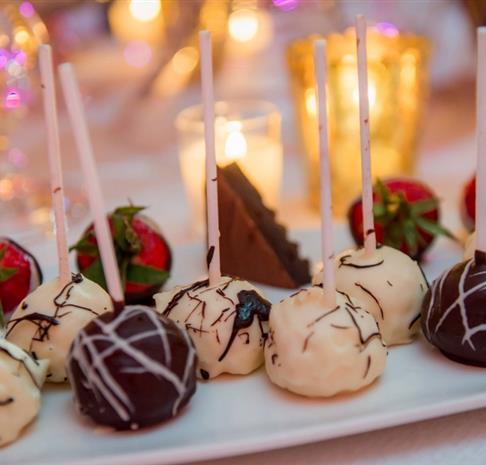 chocolate and vanilla cake pops on a table