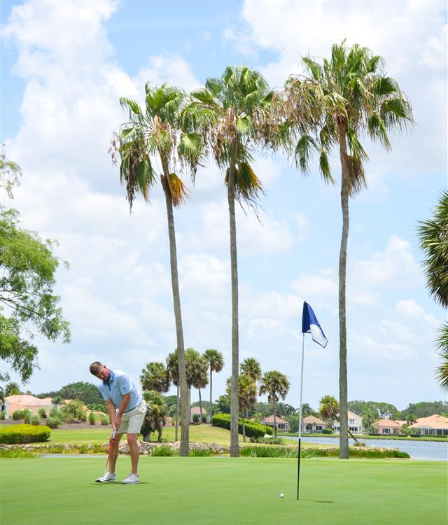 Family playing golf