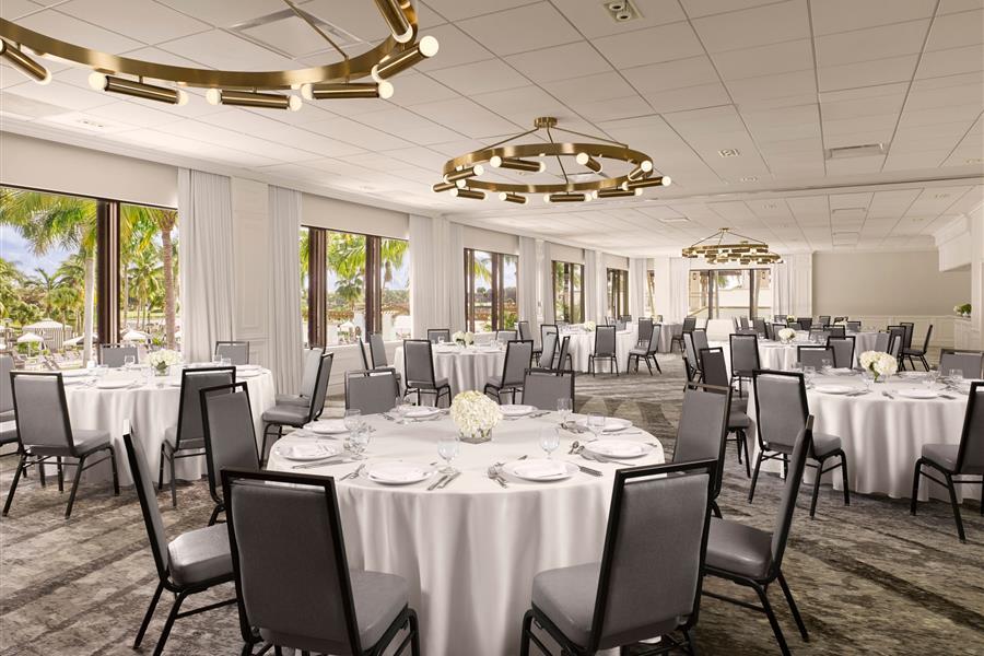 Vista ballroom event setup with floor to ceiling windows overlooking the resort pool