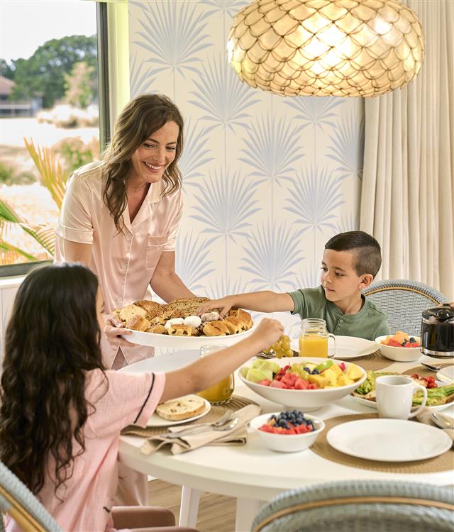 Family having a meal in a suite